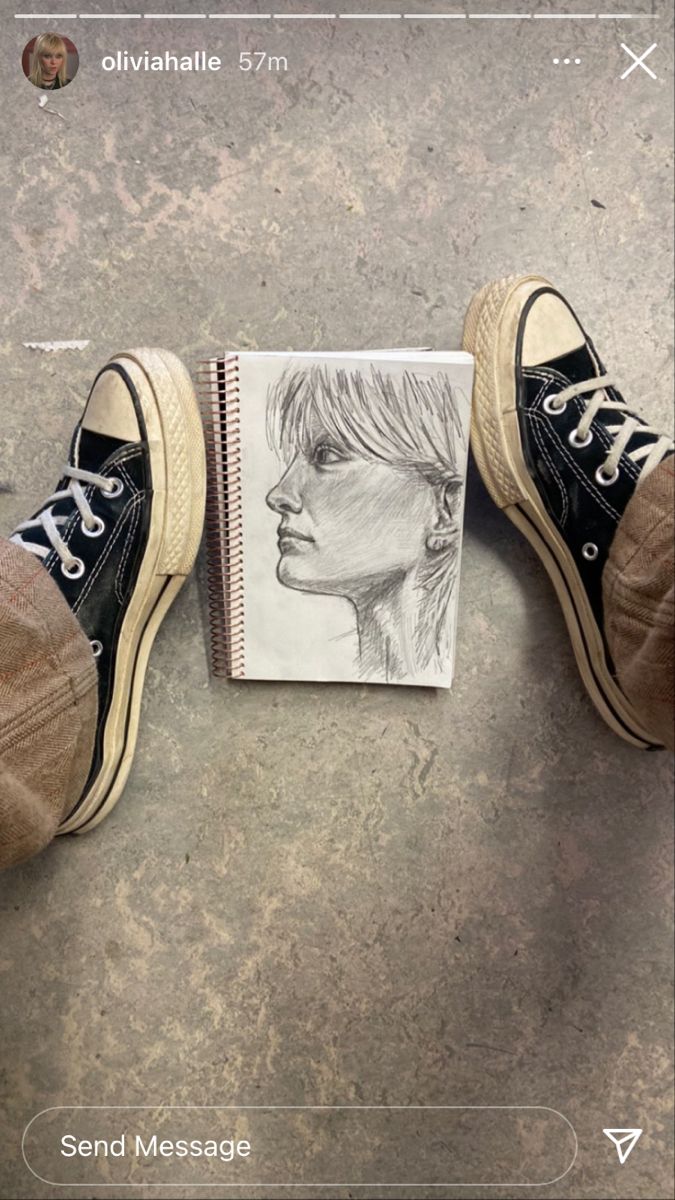 someone's feet are shown next to a drawing