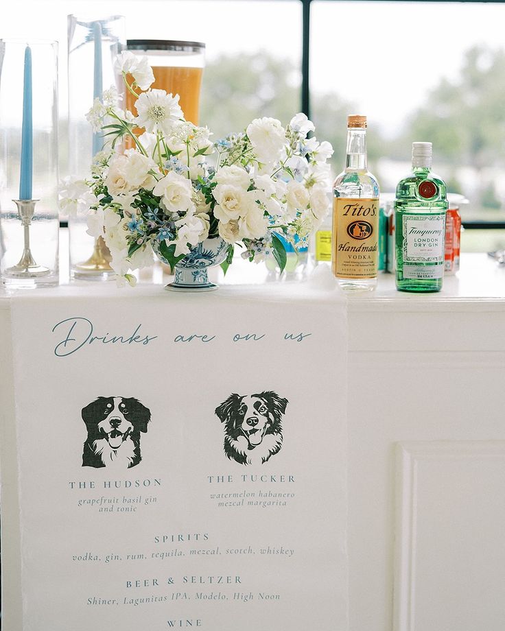 a table with flowers and drinks on it