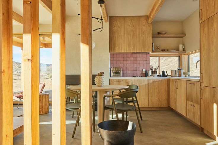 a kitchen and dining area with wooden cabinets