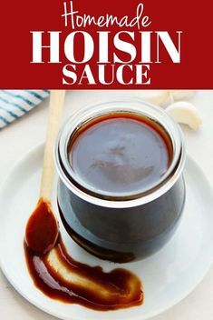 homemade hoisin sauce on a white plate with a wooden spoon