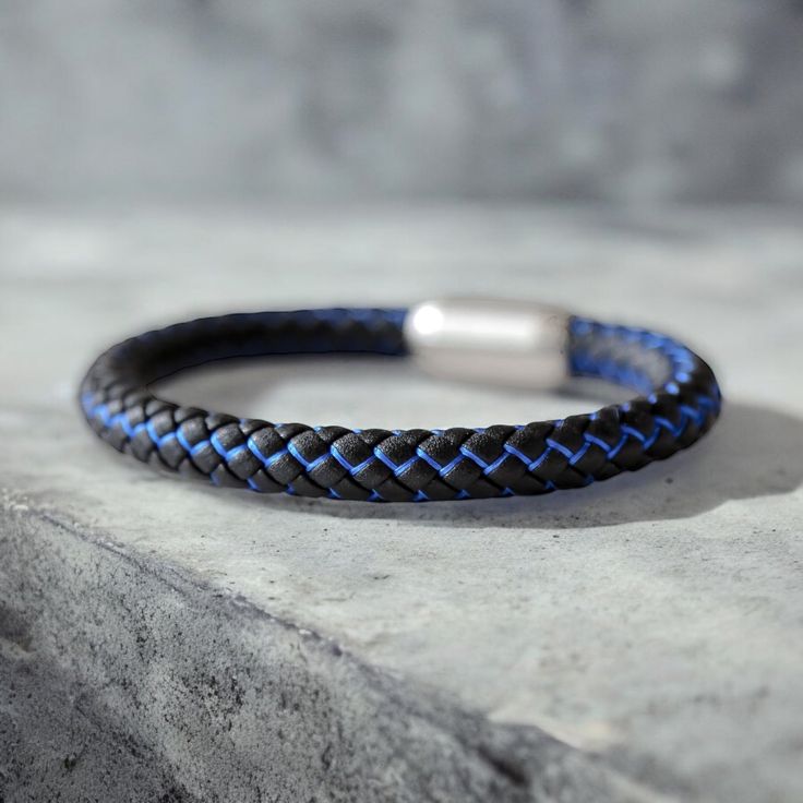 Men’s black and blue nylon rope two-tone bracelet. Has a slide lock clasp for extreme wear and durability! Fits men best who wear t-shirt sizes Medium through 3X. (8.75 inches) Casual Blue Durable Bracelets, Modern Adjustable Blue Braided Bracelets, Modern Adjustable Blue Braided Bracelet, Casual Black Braided Bracelets For Outdoor, Adjustable Blue Braided Bracelets For Outdoor, Slide Lock, Fits Men, Men's Bracelet, Mens Fitness