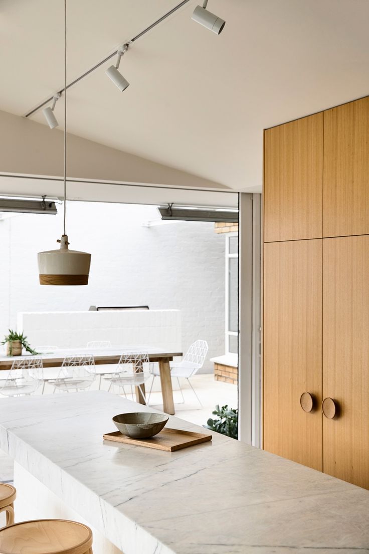 the kitchen is clean and ready to be used as a dining room or office space