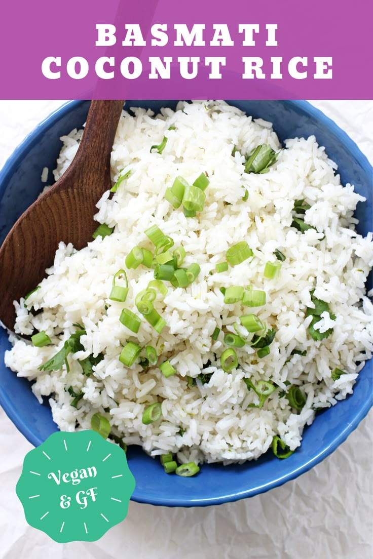 a blue bowl filled with white rice and green onions