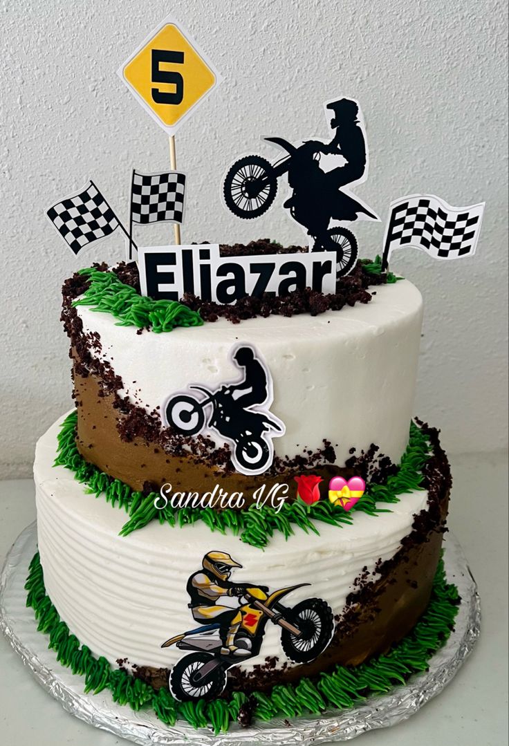 a motorcycle themed birthday cake with the number 5 on top