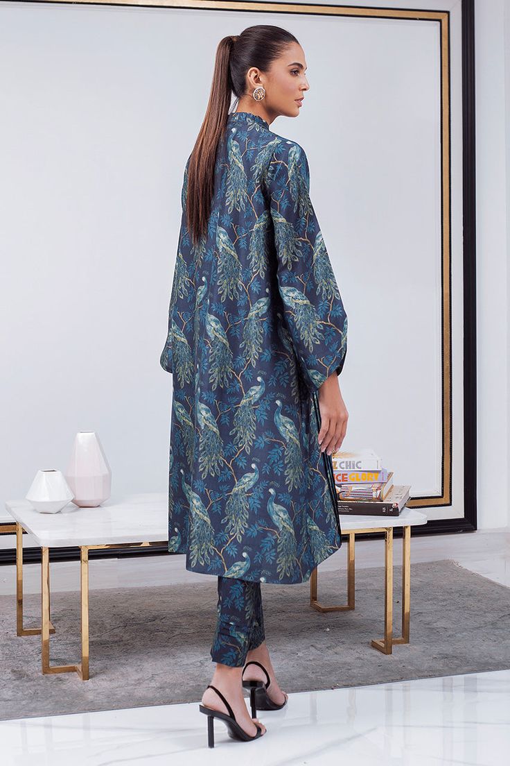 This midnight blue co-ord printed set with floral print and a ruffled neckline and pleated detailing is versatile enough for a day-to-night transition. The exaggerated sleeves add a dramatic flare to the kurta. The matching printed cropped trousers are also finished with pleated detailing. Ethnic Suit, Exaggerated Sleeves, Ruffled Neckline, How To Dye Fabric, Cropped Trousers, Raw Silk, Co Ord, Digital Photography, Hijab Fashion