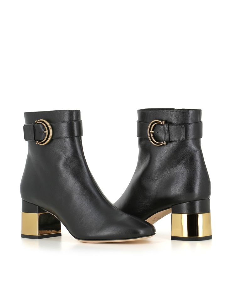 Black soft leather ankle boot by Chloè , featuring a 'C' buckle, contrasting gold heel, square toe and side zip fastening. Leather sole. Lined interior. Heel: 6,5 cmComposition: Leather Formal Gold Calf Leather Boots, Luxury Gold Leather Heeled Boots, Gold Luxury Calf Leather Boots, Luxury Gold Calf Leather Boots, Chic Calf Leather Boots With Buckle Closure, Gold Leather Ankle Heeled Boots, Gold Ankle Leather Heeled Boots, Chic Gold Leather Boots, Chic Gold Boots With Sculpted Heel