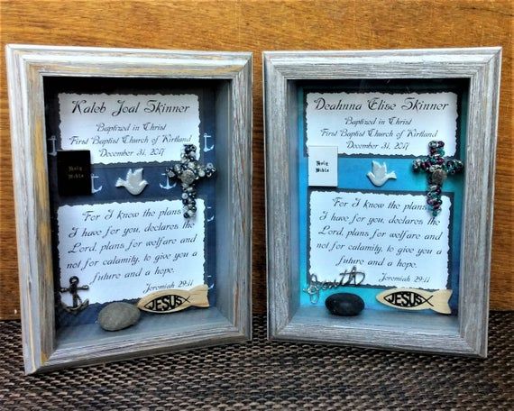 two framed pictures with words and charms on them, one has a cross in the middle