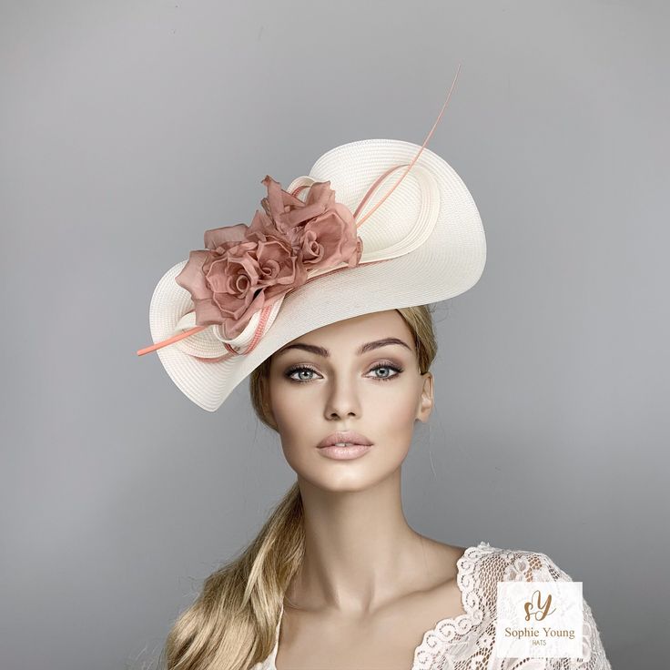 This stunning ivory hat, is adorned with a beatutiful silk flower in pink shades. This hat is perfect for horse racing like the  Kentucky Derby, Royal Ascot, Breeders Cup... luncheons, High Tea parties, Bridal Showers, wedding guest.. or any special ocasion. It is mounted on a thin satin cover headband (with silicone ends to prevent a headache) and small comb.  You can choose the side of the head where you like to wear the fascinator. Follow this link for more beautiful choices from 'Sophie Young Hats'  https://www.etsy.com/shop/sophieyounghats Pale Pink Weddings, Ivory Hat, Hat Tea Party, Hat Cream, Tea Hats, Breeders Cup, Ascot Hats, Bride Hat, Tea Party Hats