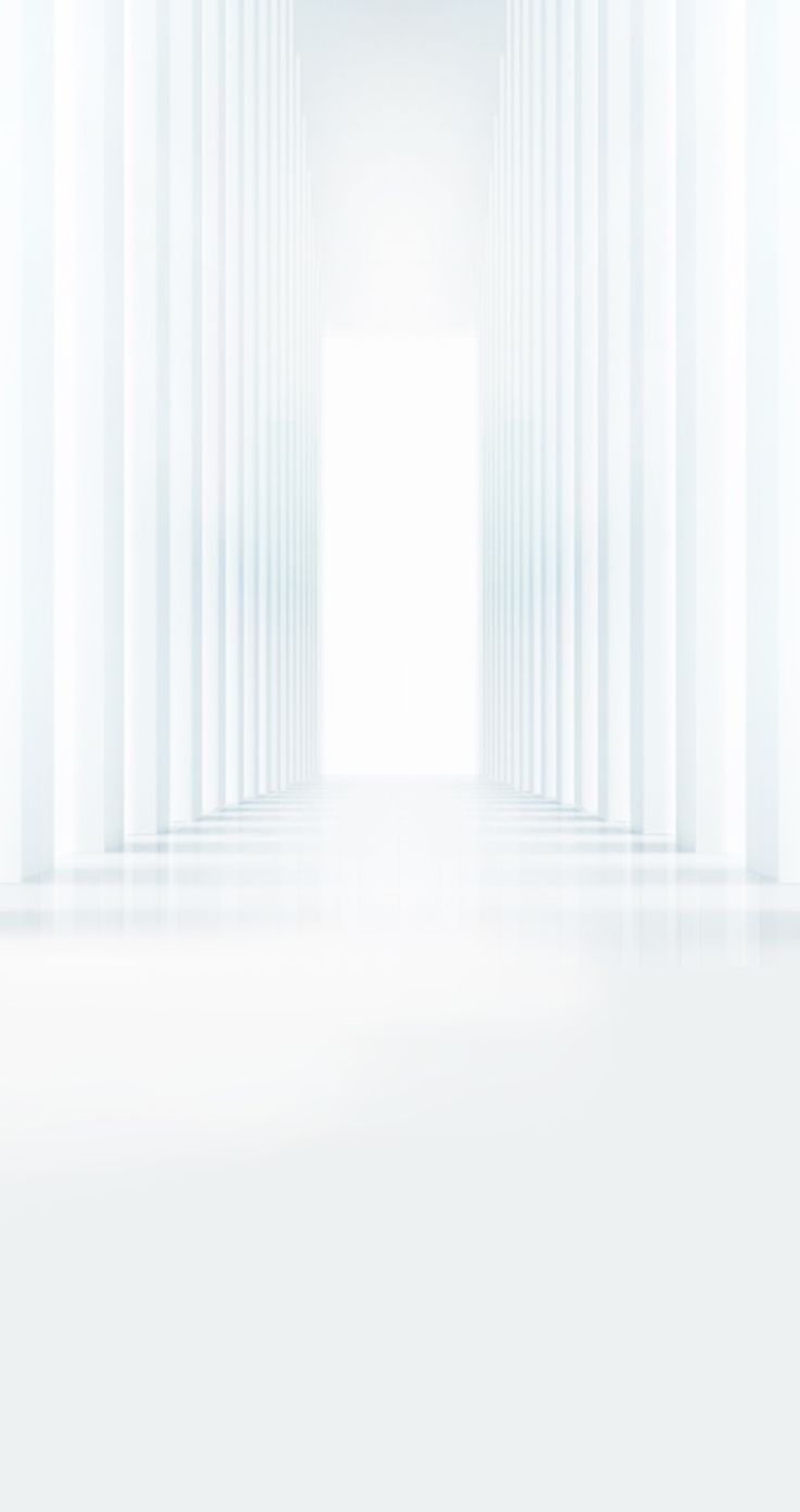 an empty white room with columns in the background