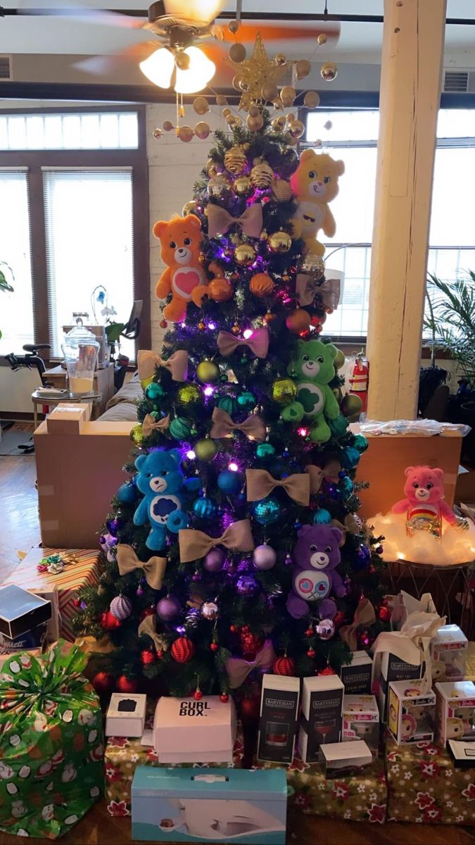 a christmas tree is decorated with teddy bears