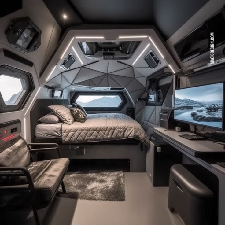 the interior of a futuristic bedroom with two computers and a bed in front of it