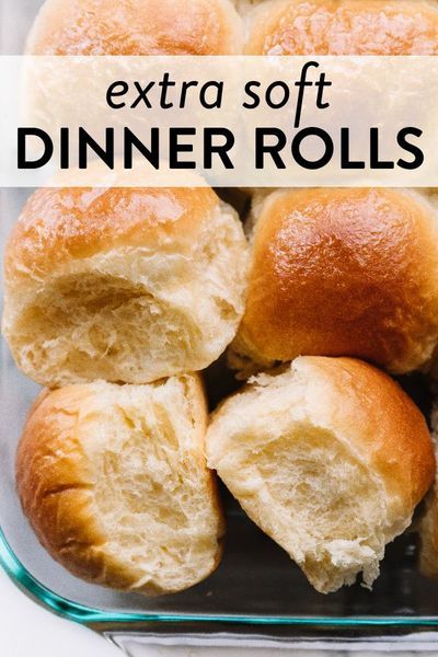 several rolls in a glass baking dish with the words extra soft dinner rolls