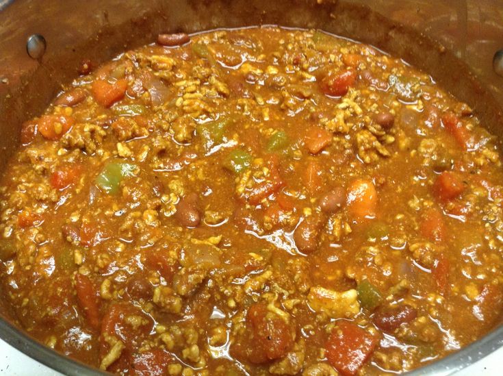 a pot filled with lots of food on top of a stove