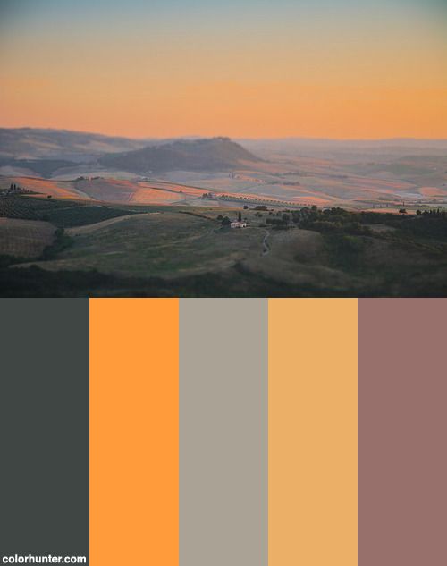 an orange and grey color palette with hills in the background at sunrise or sunset time