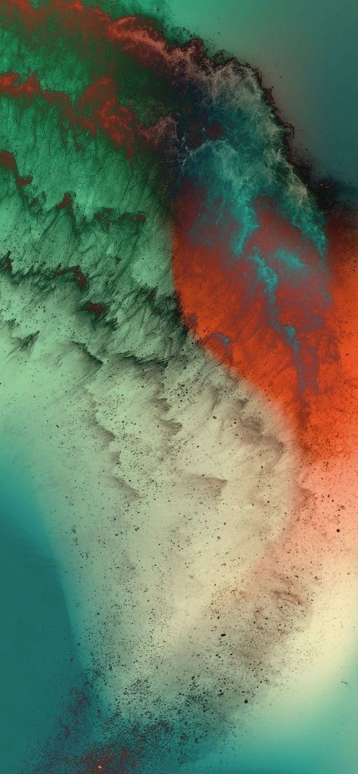 an aerial view of the ocean with red, green and blue colors on it's surface