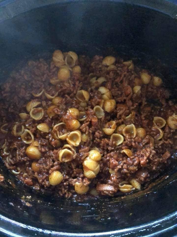 the food is cooked and ready to be eaten in the crock pot on the stove