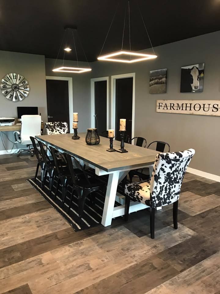 a dining room table and chairs in front of a wall with the words farmhouse on it