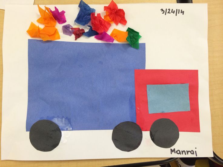 a paper cut out of the shape of a truck with colorful pieces of construction paper on it