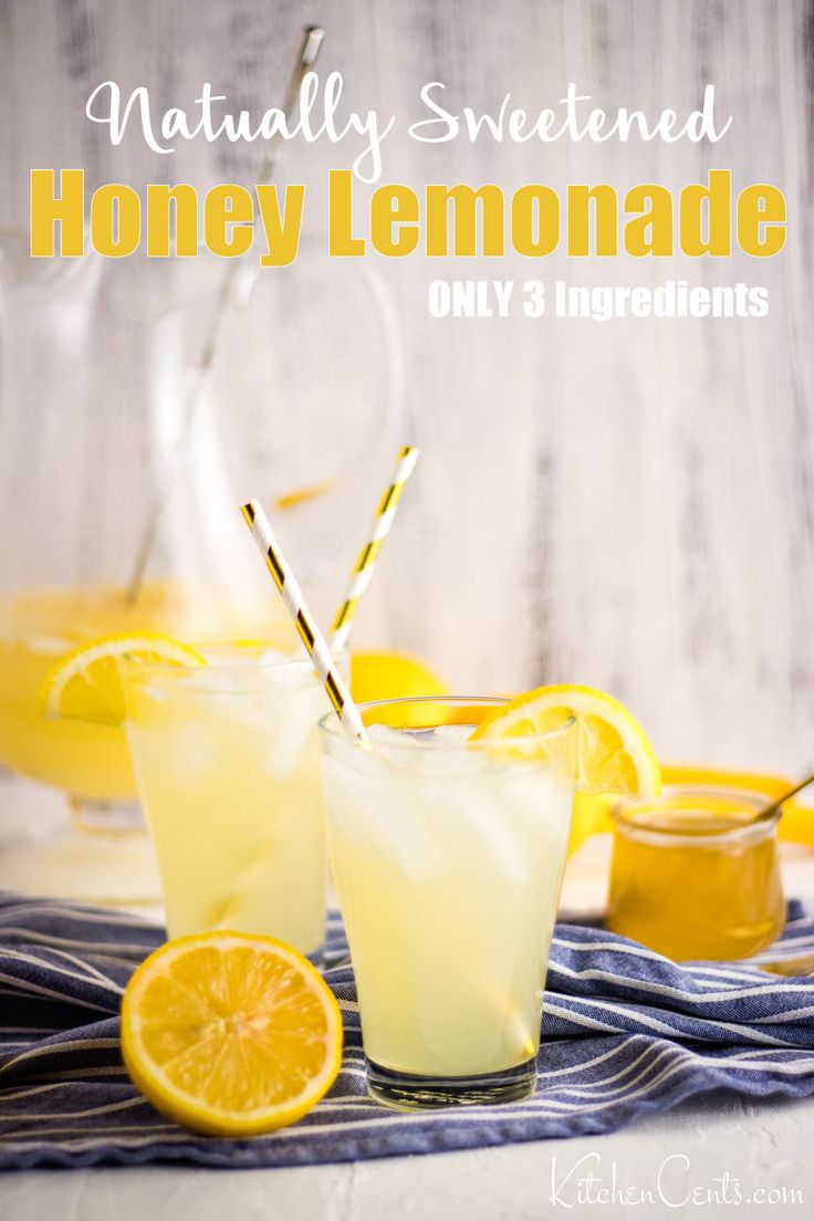 two glasses filled with honey lemonade on top of a table