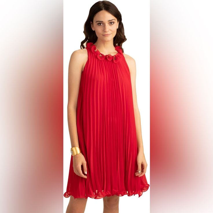 The Trina Turk Ely Dress Adds A Playful Attitude To Your Wardrobe With A Ruffled Neckline And Accordion Pleats Throughout. Refresh Your Party Look With This Bright Red Dress, Sure To Be A Standout At Every Occasion. Pleated A-Line Dress With Pull-On Design. A-Line Silhouette. Ruffled Neckline. Accordion-Pleated Overlay Do Not Steam Or Iron. Lined. 100% Polyester. Dry Clean Only. Imported. Red Pleated Chiffon Dress, Chic Red Pleated Party Dress, Elegant Flowy Pleated Dress For Party, Chic Red Pleated Summer Dress, Flowy Sleeveless Pleated Dress For Parties, Elegant Red Pleated Summer Dress, Elegant Red Flowy Mini Dress, Sleeveless Chiffon Pleated Dress For Party, Sleeveless Chiffon Pleated Party Dress