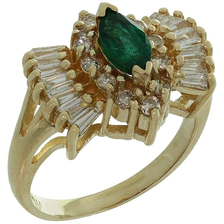 This elegant ring is crafted in 14k yellow gold and set with a gorgeous deep green sparkling marquise-cut emerald, accented with round brilliant-cut and baguette-cut diamonds of an estimated 1.36 carats. The emerald weighs an estimated 0.70 carats and has some light imperfections. Made in United States circa 1980s. Measurements: 0.55" (14mm) width. The ring size is 6.25 - EU 53. Resizable. Sizing fees will be provided upon request. Ring Board, Diamond Gold Ring, Rings Luxury, Baguette Cut Diamond, Diamond Gold, Elegant Ring, Gold Diamond Rings, Marquise Cut, Emerald Diamond