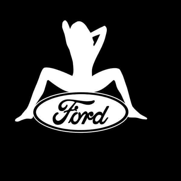 a woman sitting on top of a ford logo