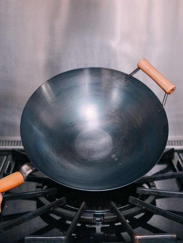 a wok is sitting on top of the stove