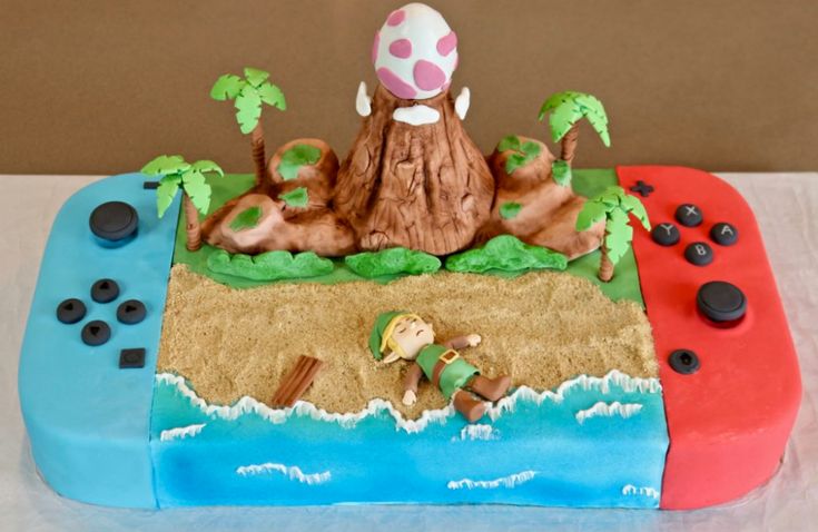 a cake made to look like a video game console with a mushroom on the top