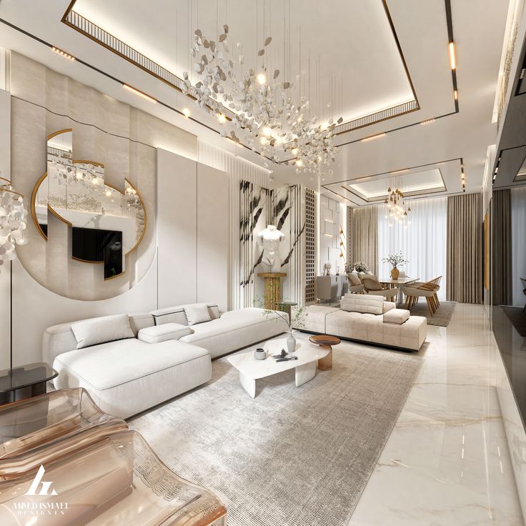 a large living room with white furniture and chandelier hanging from the ceiling,