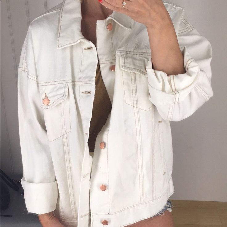 This Off White/Cream Colored Jean Jacket Is Really Something. I Was Going To Keep It For Myself But I Have Too Many Jean Jackets! It’s A Real Beauty! The Gold/Bronze Buttons Just Make It That More Beautiful! I Love The Oversized Fit! This Jacket Also Has These Hidden Pockets On The Inside! *Free People Logo Is Upside Down Inside Of Jacket *Also Seems To Be A Small Ink Mark On The Inside (Not Noticeable At All, See Pics) White Button-up Denim Jacket For Day Out, Chic Cream Cotton Outerwear, White Oversized Outerwear With Pockets, Oversized White Outerwear With Pockets, Beige Long Sleeve Denim Jacket Casual, Trendy Cream Outerwear For Spring, White Button-up Outerwear With Pockets, Trendy Cream Outerwear With Pockets, Casual Neutral Outerwear For Summer