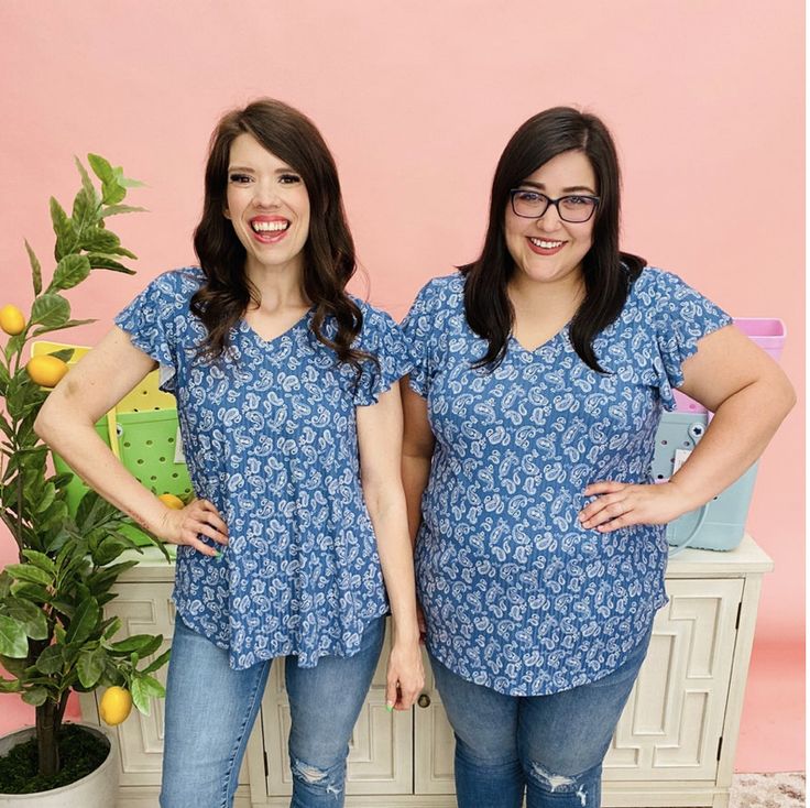 Denim tops are always a flattering color to wear! Casual Blue Flutter Sleeve Tops, Casual Blue Paisley Print Tops, Flowy Cotton V-neck Tops, Summer Stretch Paisley Print Top, Stretch Paisley Print Summer Tops, Casual Short Sleeve V-neck Top With Floral Print, Casual Floral Print Short Sleeve V-neck Top, Blue Paisley Print Casual Blouse, Stretch Floral Print V-neck Top