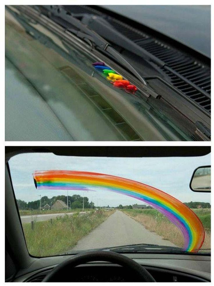 a rainbow painted on the windshield of a car