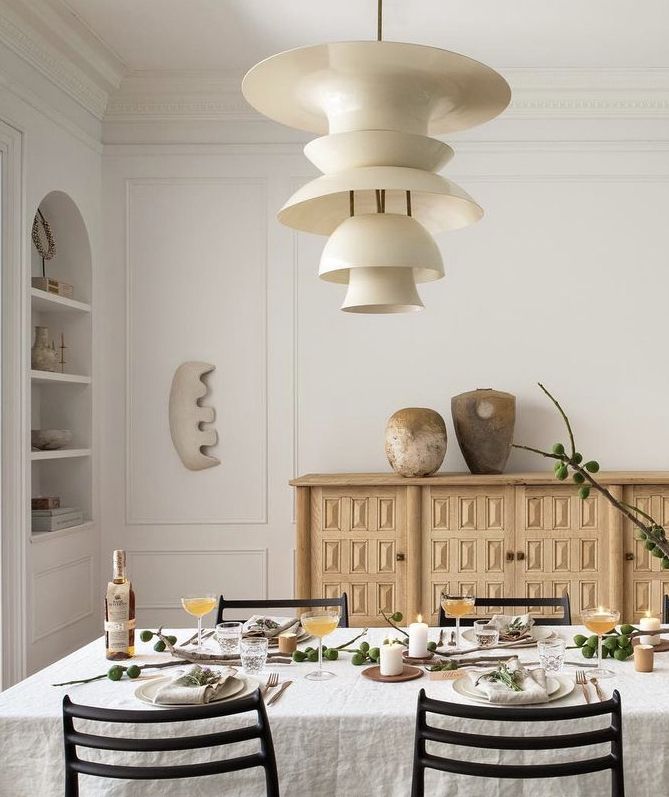 a dining room table is set with plates and glasses