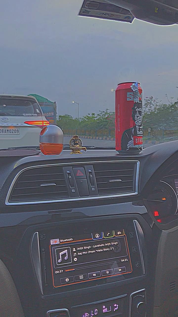 the dashboard of a car with an electronic device on it