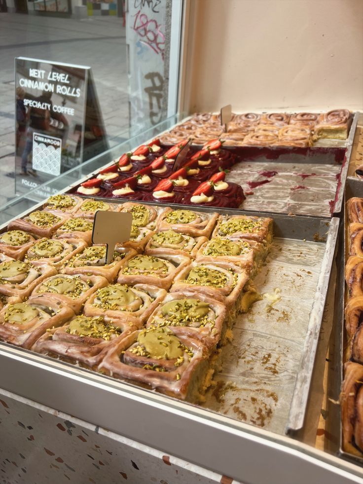 many different types of pastries are on display