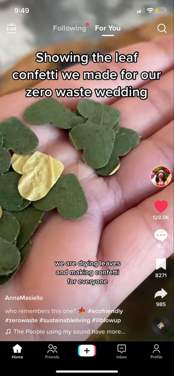 someone is holding some green leaves in their hand with the caption saying, showing the leaf confetti we made for our zero waste wedding