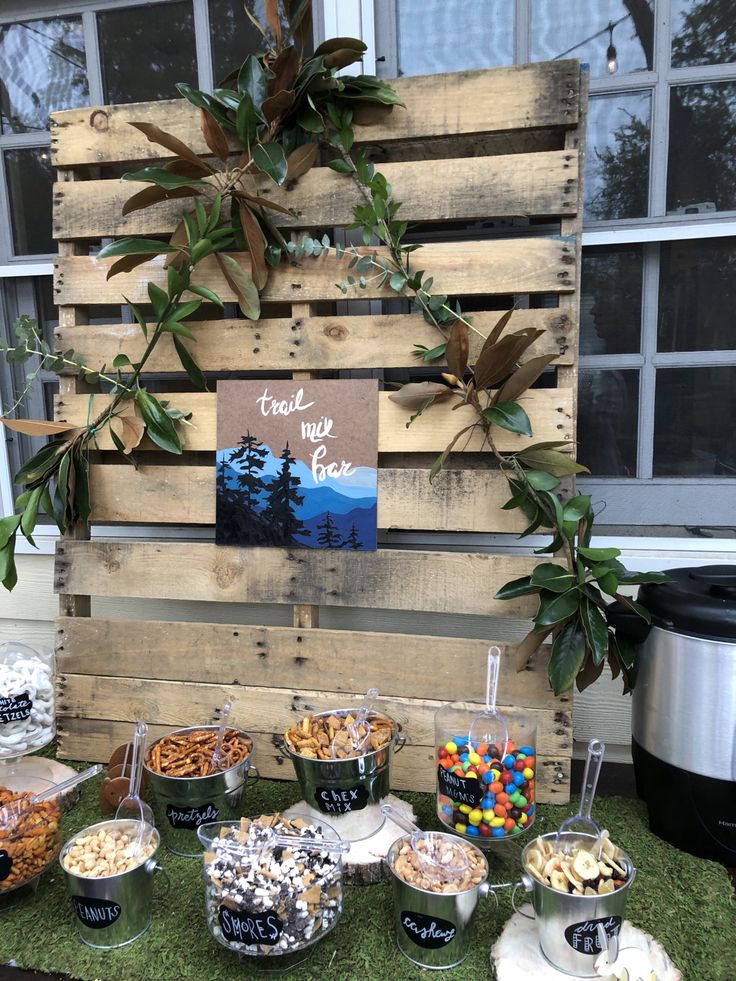 a table topped with lots of food next to a sign that says thank you for