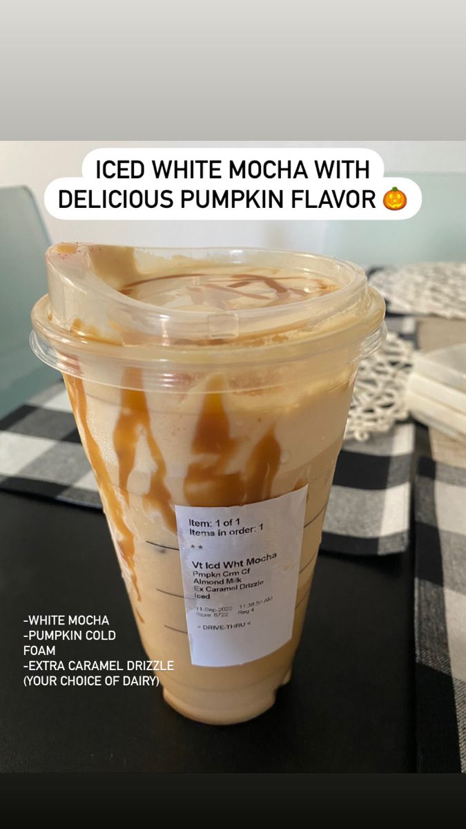 iced white mocha with delicious pumpkin flavor in a plastic cup sitting on a table