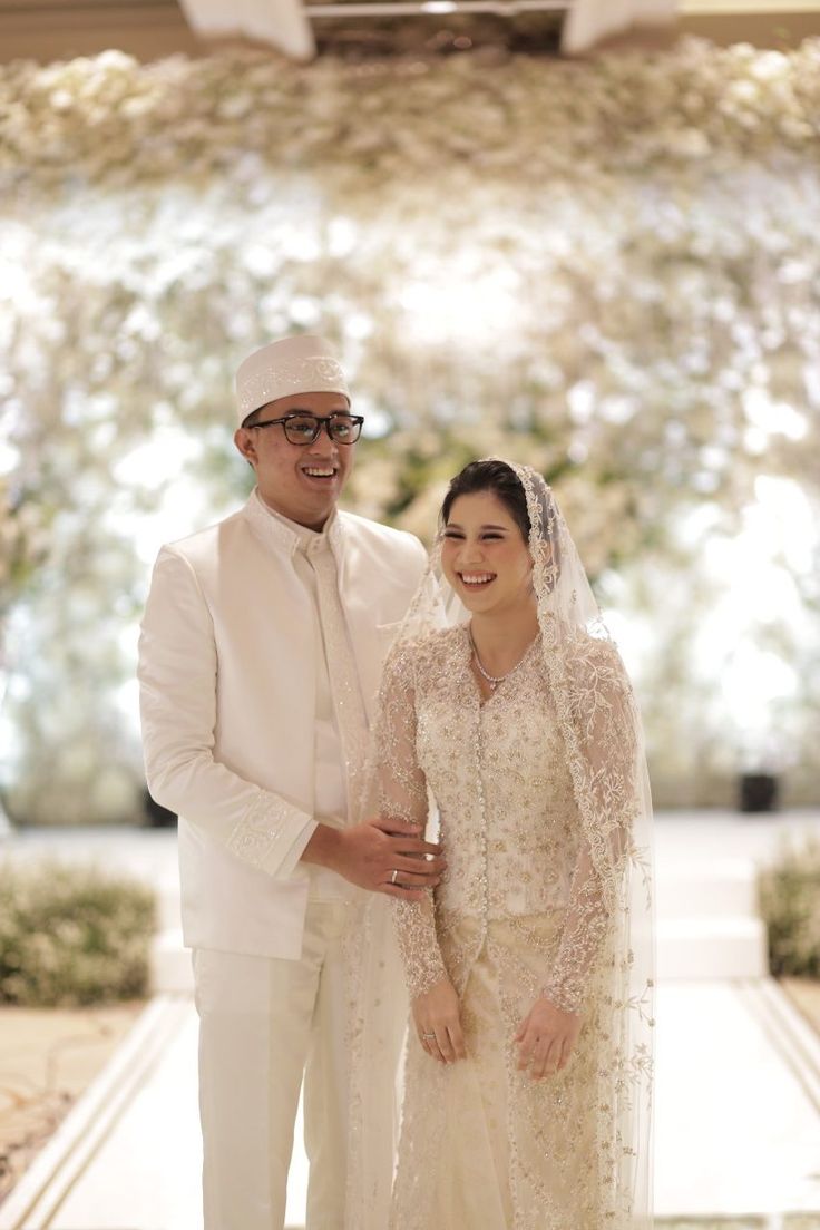 the bride and groom are posing for a photo