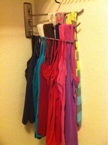 there is a rack with clothes hanging on it