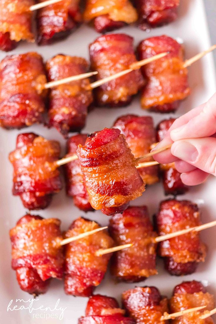 bacon skewers on a white plate with toothpicks