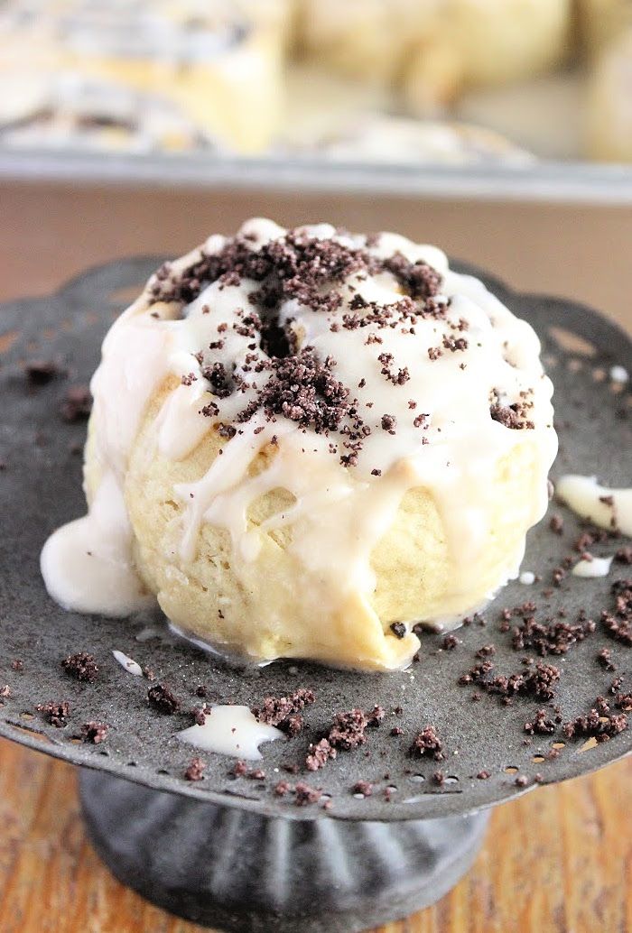 an oreo sweet rolls with white icing and chocolate sprinkles on top