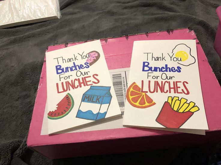 two lunch boxes that are sitting on a bed with the words thank you bunnies for our lunches