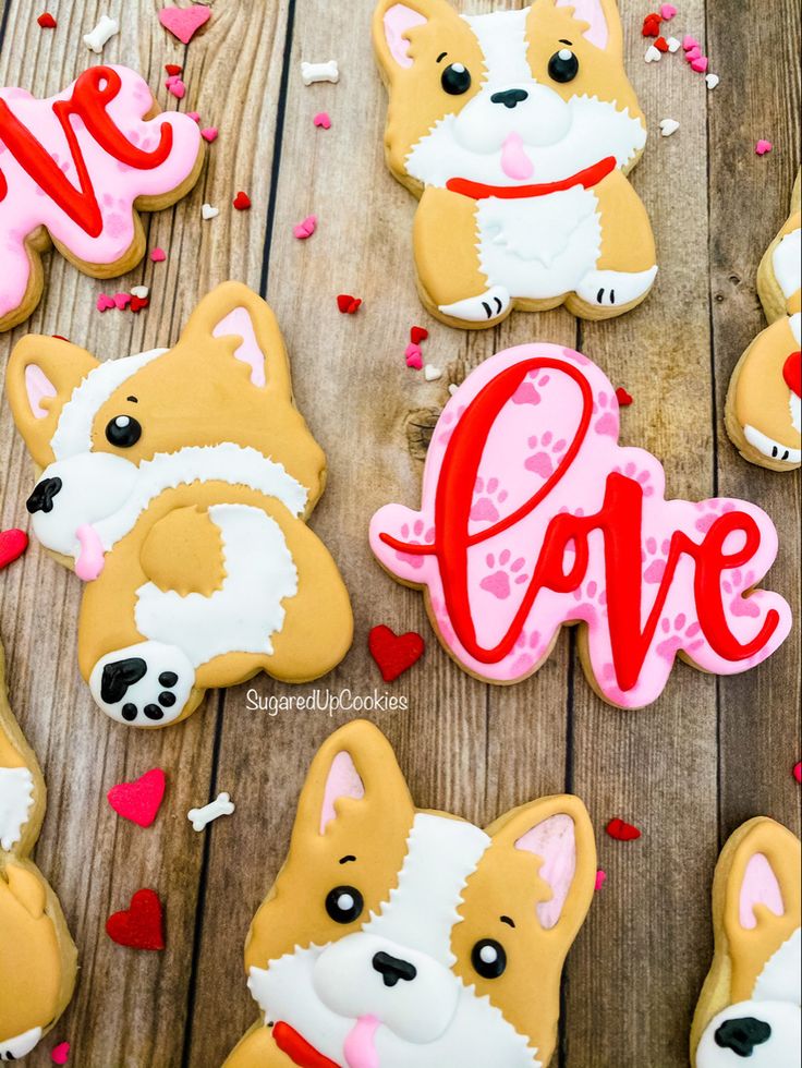 decorated cookies with the words love and corgi dogs on them for valentine's day