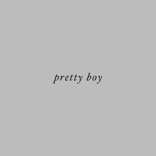 the words pretty boy are written in black on a gray background, and there is no image to describe