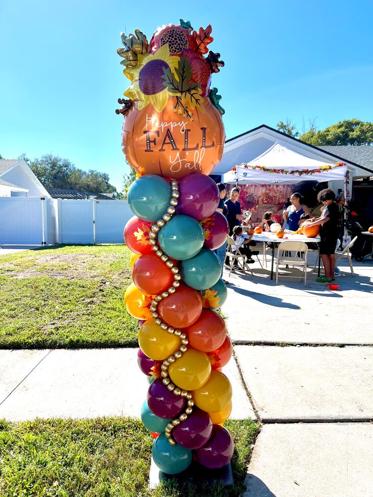 a tall balloon column with balloons on it