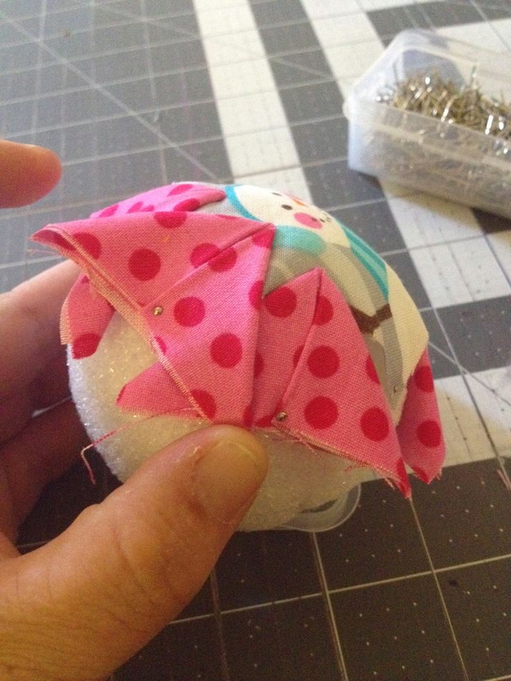 someone is making a doll out of fabric