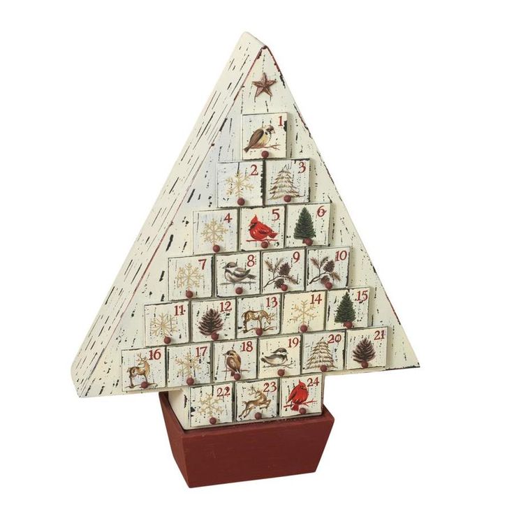 a christmas tree made out of wooden blocks with pictures on it's sides and numbers in the middle