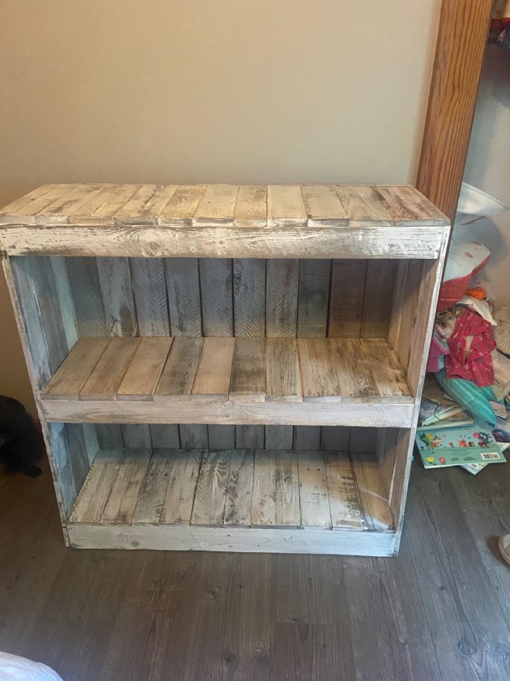 two wooden shelves sitting on top of a hard wood floor