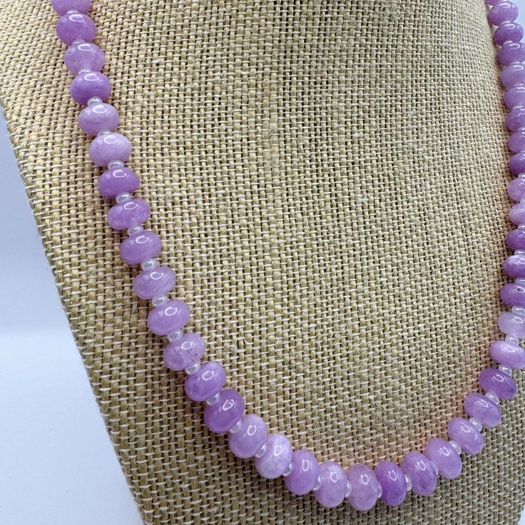 This elegant Lavender Sugar Gemstone Necklace is designed to add a touch of sophistication to any outfit. It features beautiful gemstones that exude a sense of calm and peace. Handcrafted with care, this necklace necklace commands attention, with its adjustable design perfect for layering and a vibrant pop of color to amp up any look! Adjustable Crystal Necklaces With Gemstone Beads, Elegant Amethyst Necklace For Healing, Lavender Round Jewelry With Faceted Beads, Adjustable Crystal Necklace With Natural Stones, Elegant Rondelle Crystal Necklace For Healing, Elegant Crystal Gemstone Necklaces, Adjustable Gemstone Rondelle Necklaces, Purple Single Strand Beaded Necklace, Adjustable Single Strand Crystal Necklace